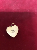 Pendent: 14 kt Gold Stamped out Heart with Opal stone.