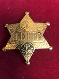 Badge: Solid brass engraved Sheriff
