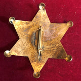 Badge: Solid brass Deputy U. S. Marshal Oklahoma Terr.