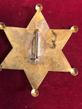 Badge: Solid brass Sheriff