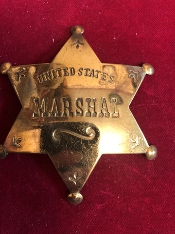 Badge: solid brass United States Marshal