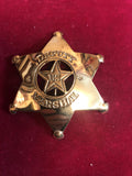 Badge: Solid brass Deputy U.S. Marshal with cut out star.